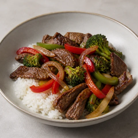 Beef and Capsicum Stir-Fry with Rice. A stir-fry built on ginger, garlic and lime rather than soy sauce, because most soy sauce is brewed with wheat and this one needs no substitute to taste like something.