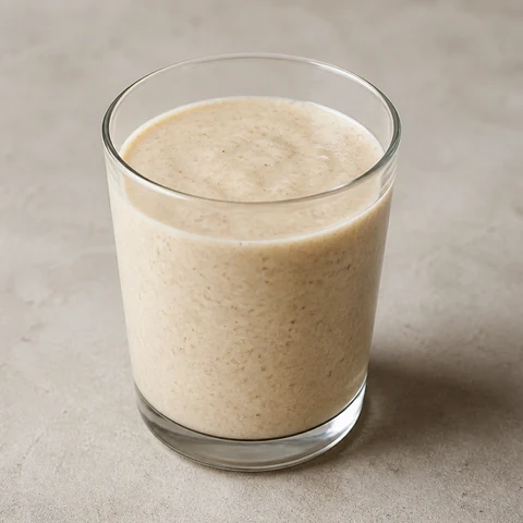 Banana and Oat Smoothie with Yoghurt. Blended oats, banana, yoghurt and milk. Drinkable, mild, and quick enough for a morning where sitting down to eat is not happening.